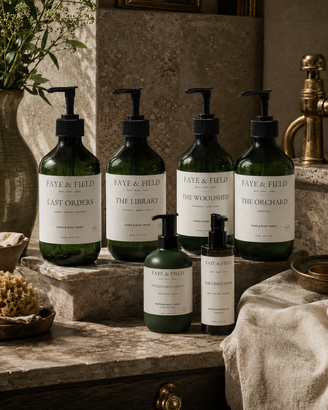 Six Faye & Field bath and body products arranged on a stone vanity in a warm British country-house bathroom.